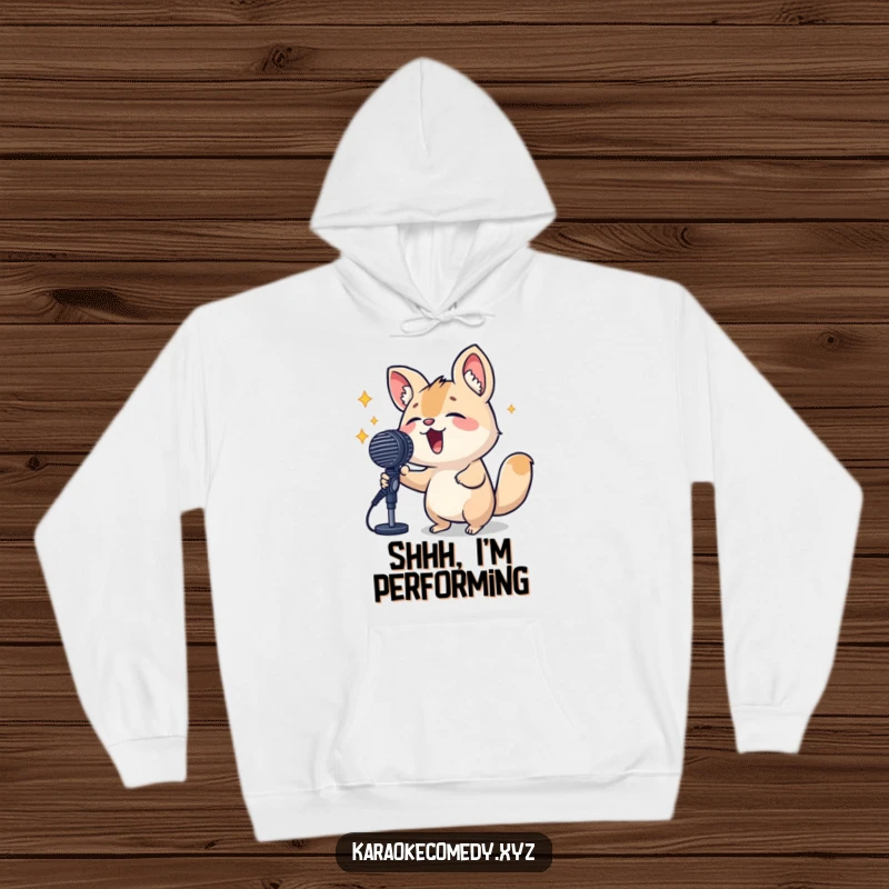 Funny Hoodie depicting a small, determined animal passionately singing into a large microphone, radiating confidence and musical talent.